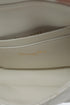 Acercamiento date code 86-MA-0233 en tag interior Dior