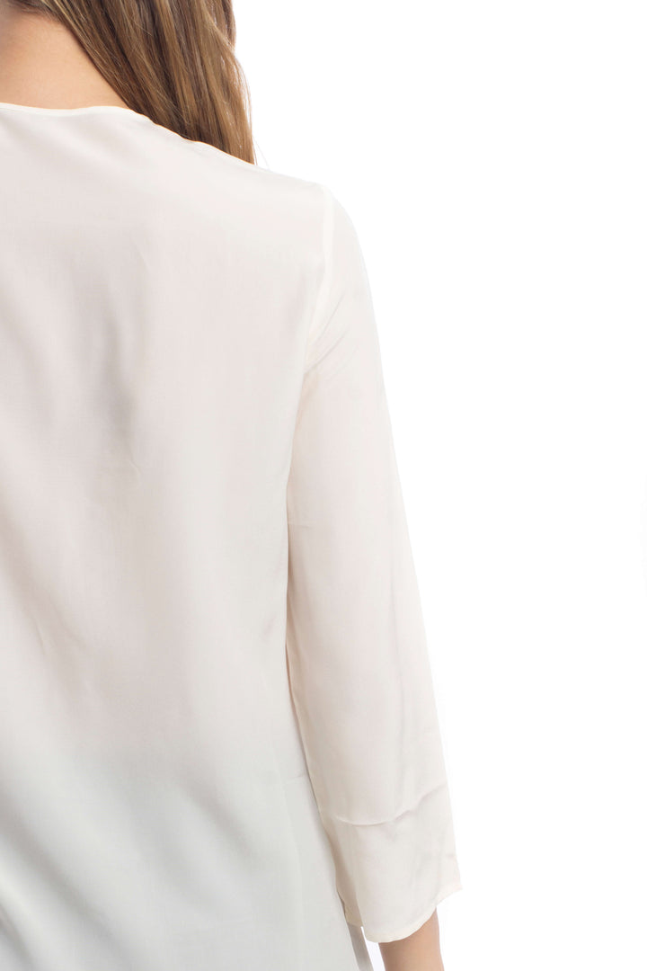 Blusa Salvatore Ferragamo de seda marfil, detalle de la espalda