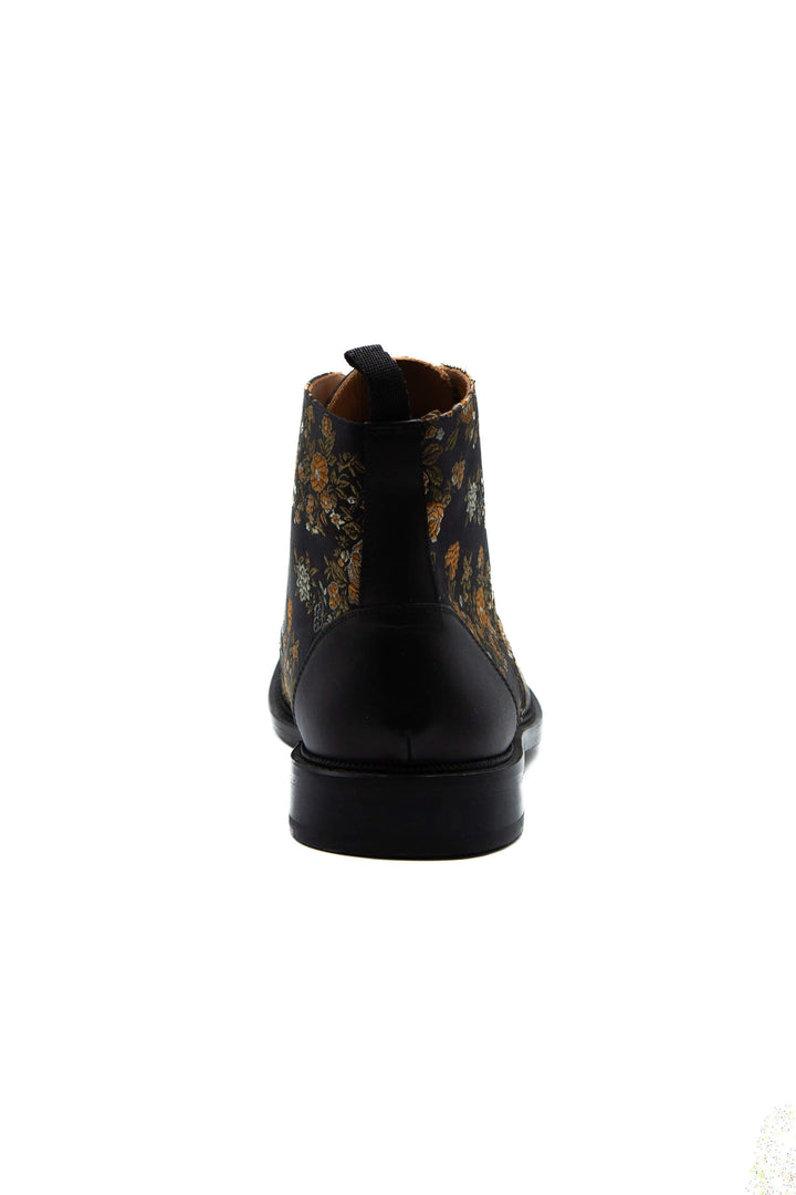 Bota Taft jacquard negro y dorado, acercamiento al jacquard floral