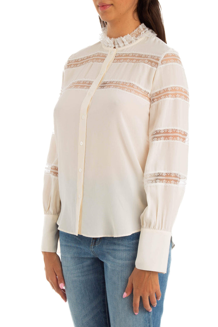 Blusa Sandro blanca con franjas de encaje, vista lateral