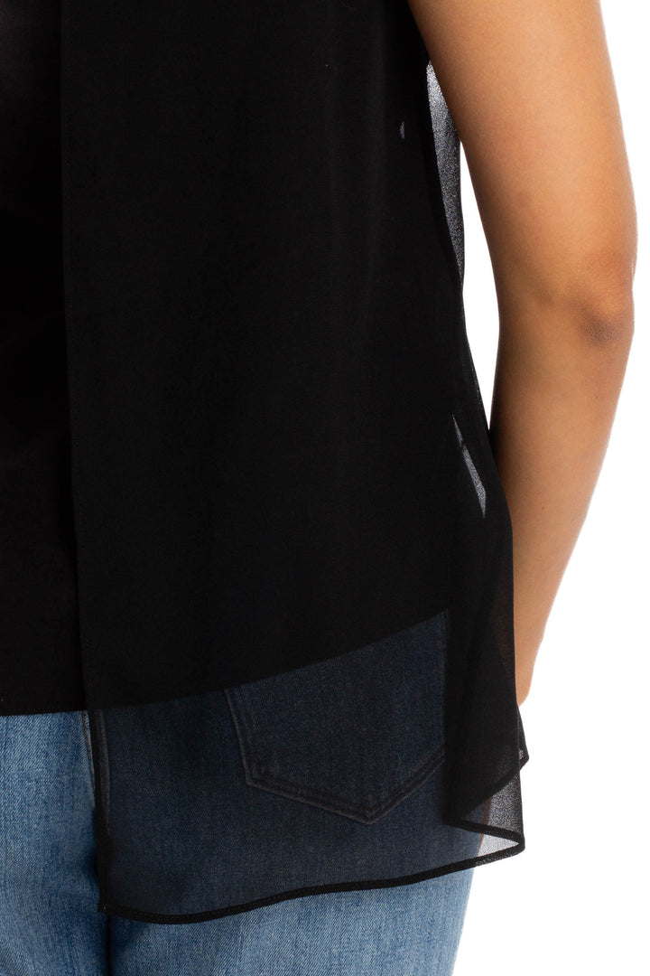 Blusa Calvin Klein Jeans negra sin mangas asimétrica, detalle de la bastilla