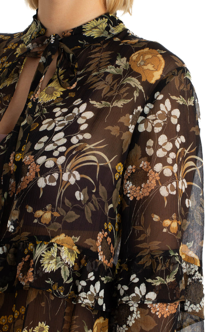 Blusa Robert Rodriguez floral transparente de manga larga, detalle lateral